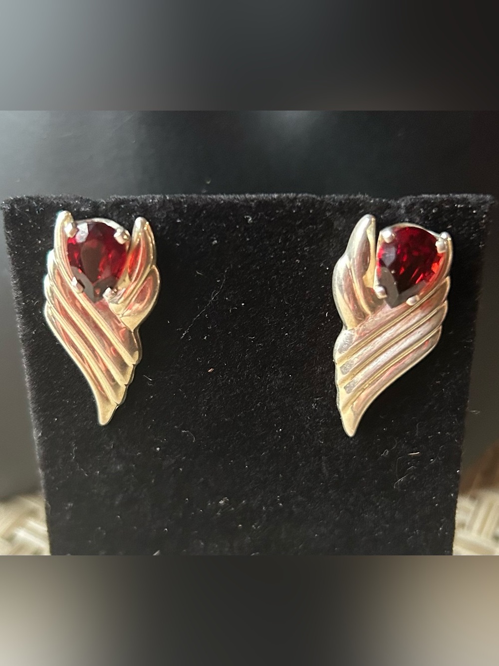 Sterling, silver and garnet wing shaped pierced earrings. Nouveau inspired.